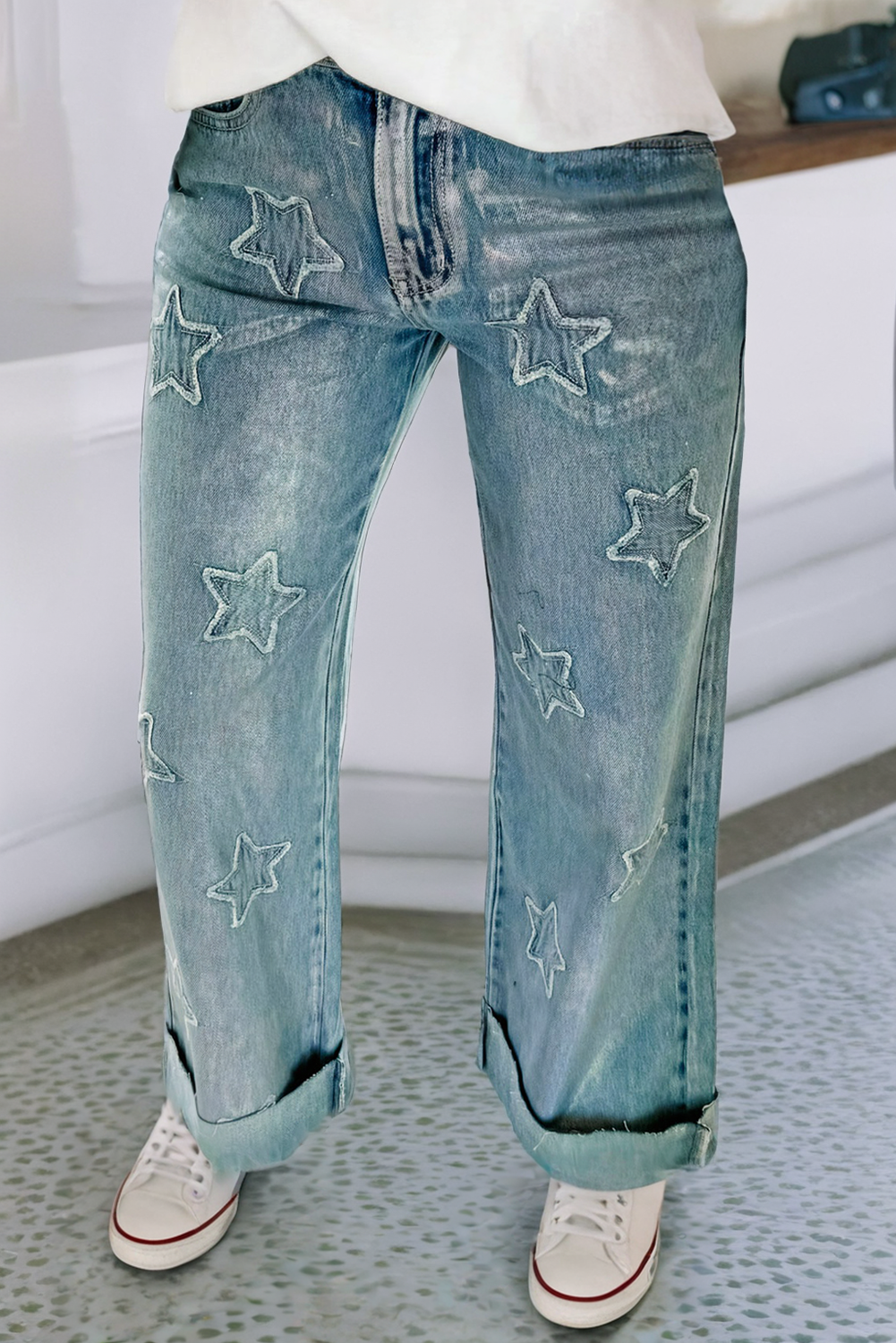 These jeans are a unique and stylish addition to any wardrobe. They feature a western chic design with stars along the front with a straight-legged cut jean to add a modern look.