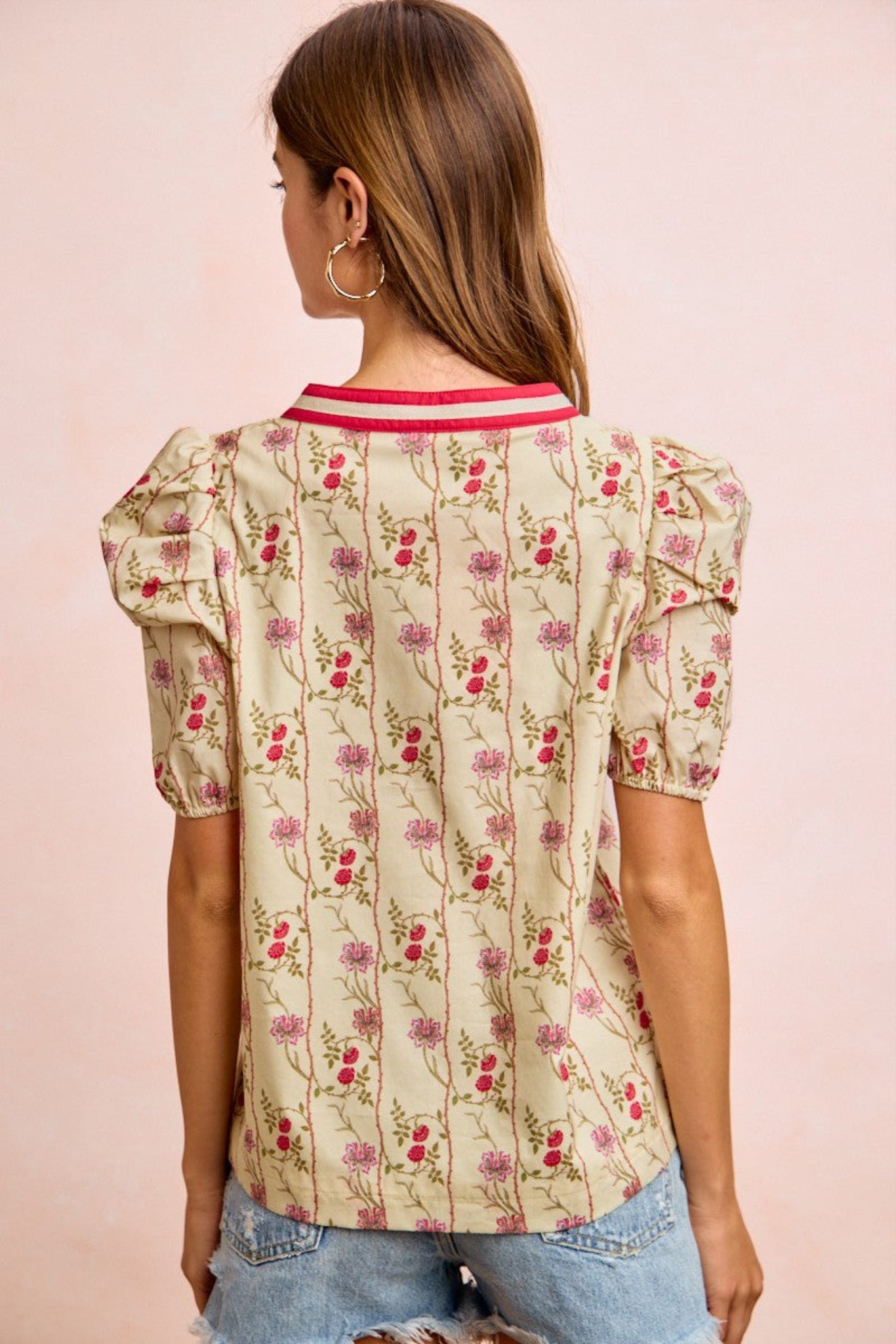 BiBi floral blouse featuring soft lightweight fabric, gathered sleeves, and contrast neckband detail with a feminine floral print design. Relaxed boutique top perfect for casual everyday outfits, spring styling, and effortless chic looks.