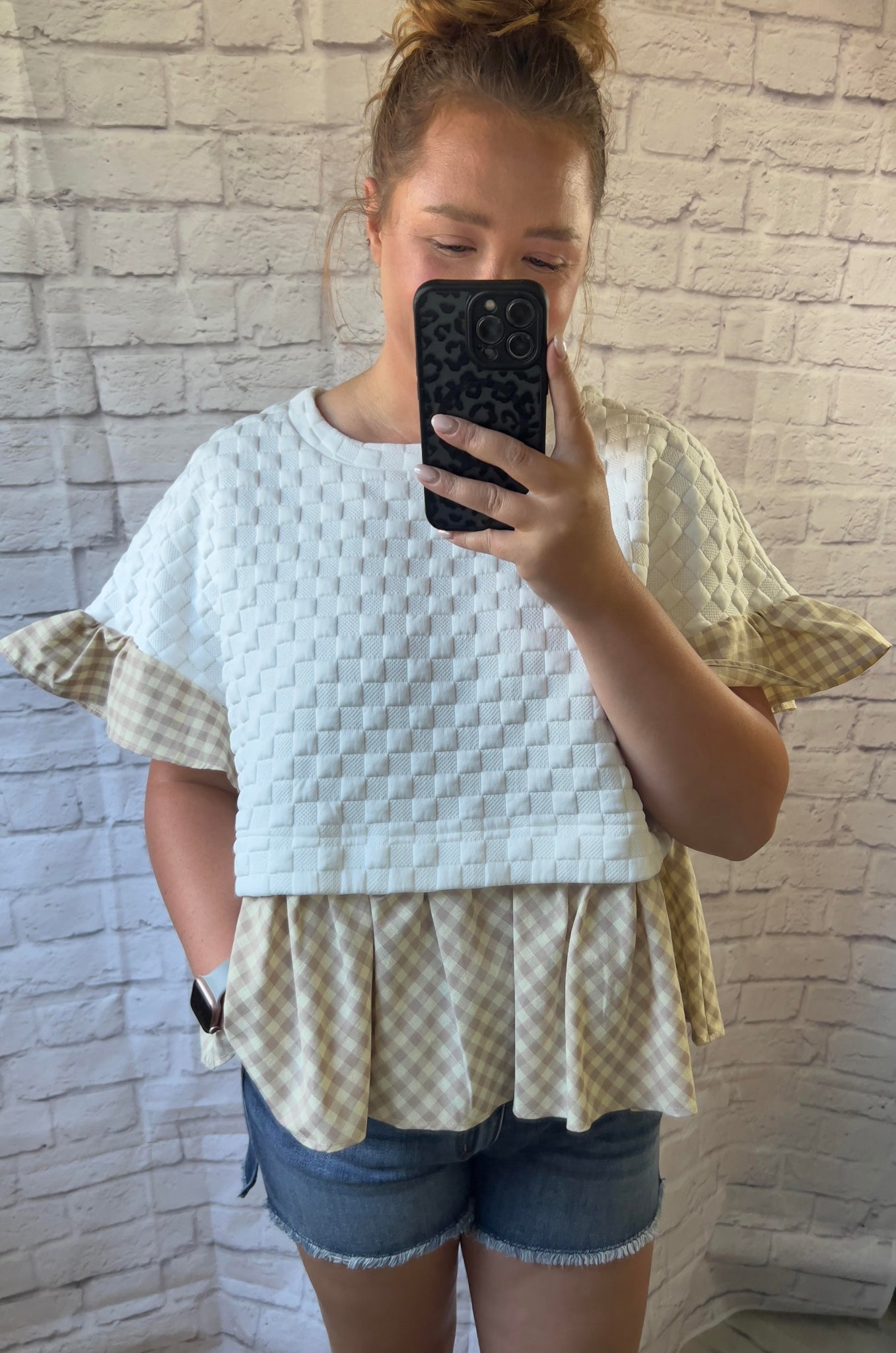 white and tan checkered textured top