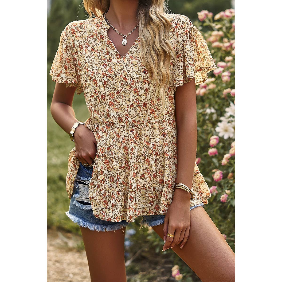 This western chic floral shirt is a versatile piece and a great transition to fall. The brown and tan colors add a western flare.
