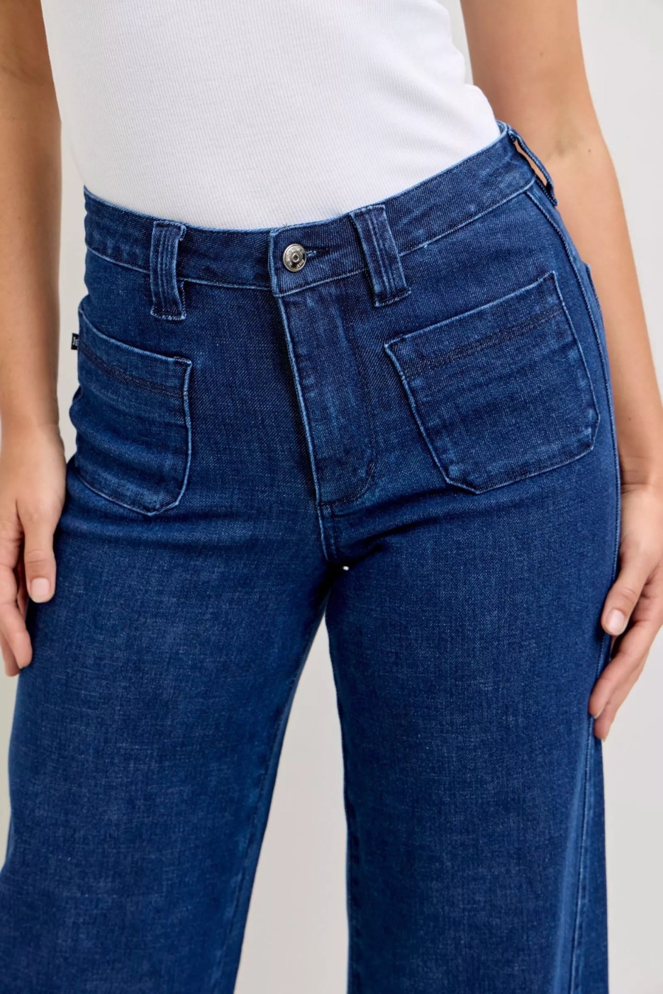 Women’s high rise dark wash wide leg jeans with front patch pockets and comfort stretch denim