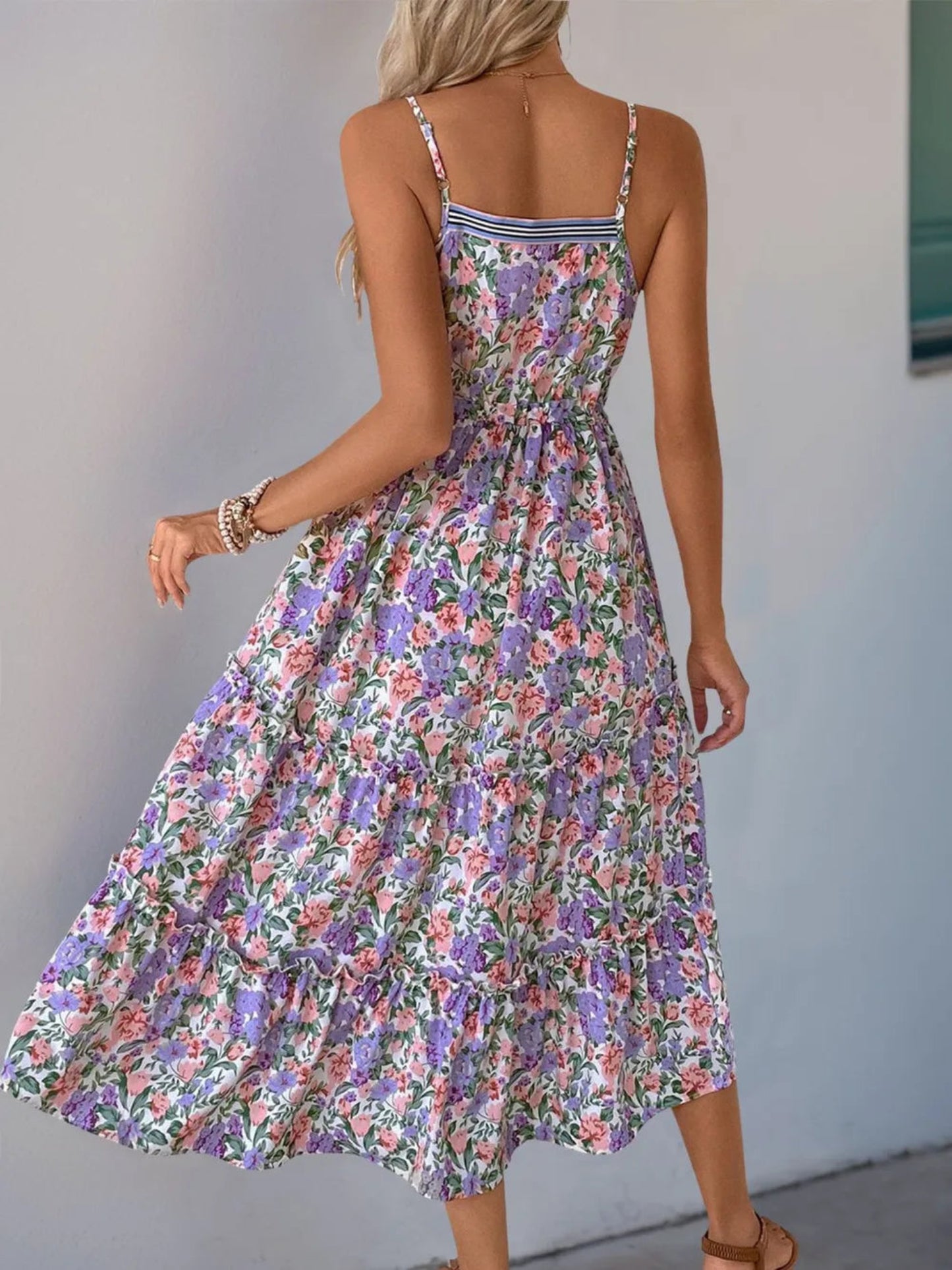 Floral tiered maxi dress with lavender, pink, and green print, adjustable spaghetti straps, drawstring waist, and flowy lightweight fabric for spring and summer