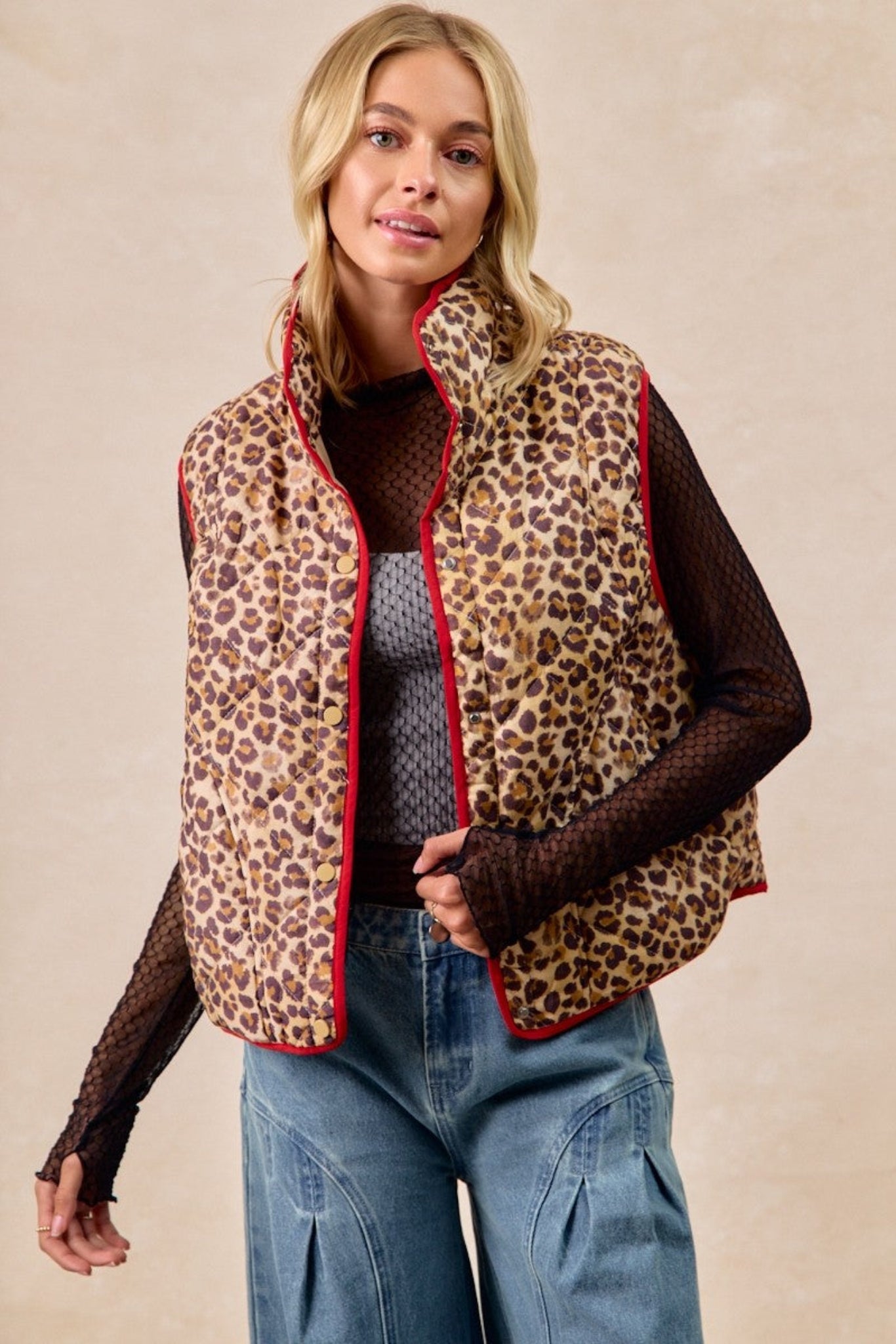 BiBi leopard print quilted vest featuring cozy padded fabric, contrast piping detail, and lightweight sleeveless design perfect for layering. Trendy boutique outerwear with relaxed fit and stylish animal print for casual fall and winter outfits.
