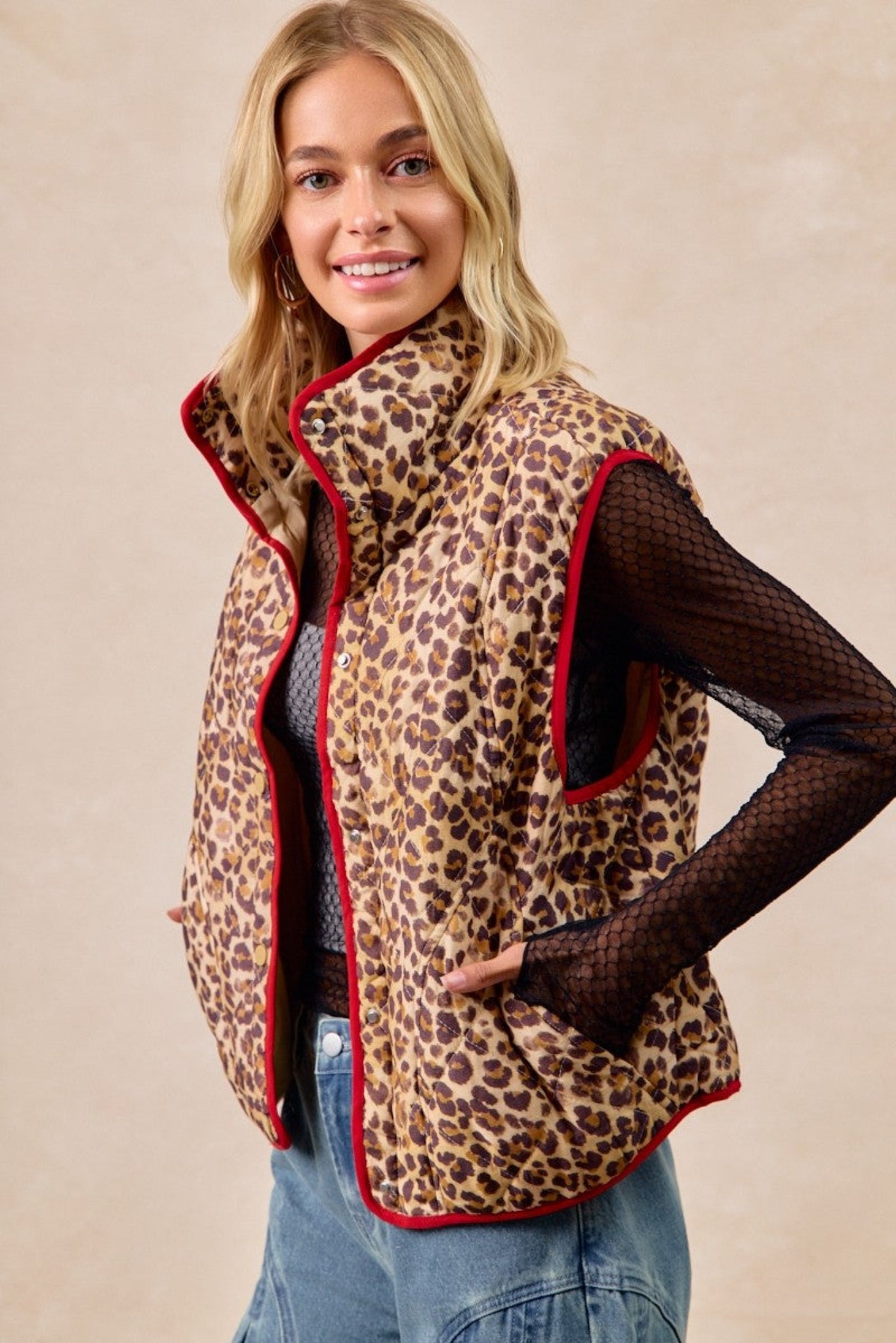 BiBi leopard print quilted vest featuring cozy padded fabric, contrast piping detail, and lightweight sleeveless design perfect for layering. Trendy boutique outerwear with relaxed fit and stylish animal print for casual fall and winter outfits.