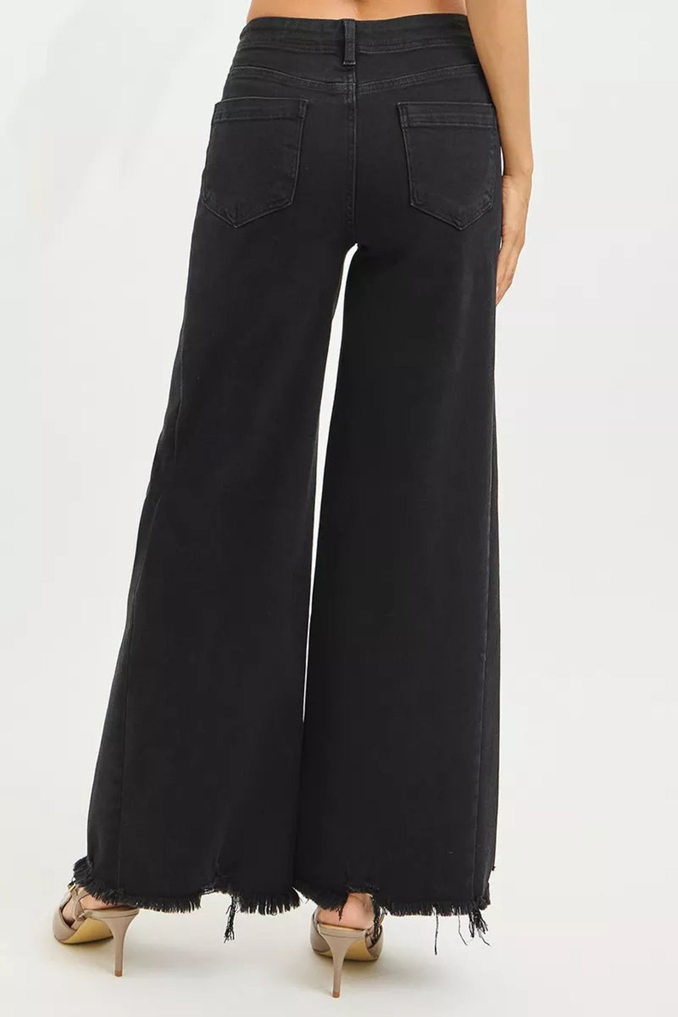 High waisted black wide leg denim jeans with raw edge hem and full length cut