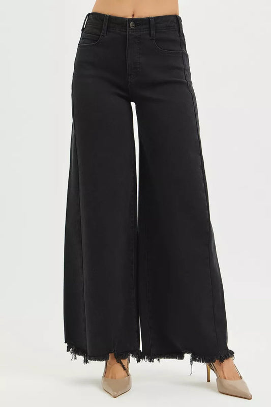 High waisted black wide leg denim jeans with raw edge hem and full length cut