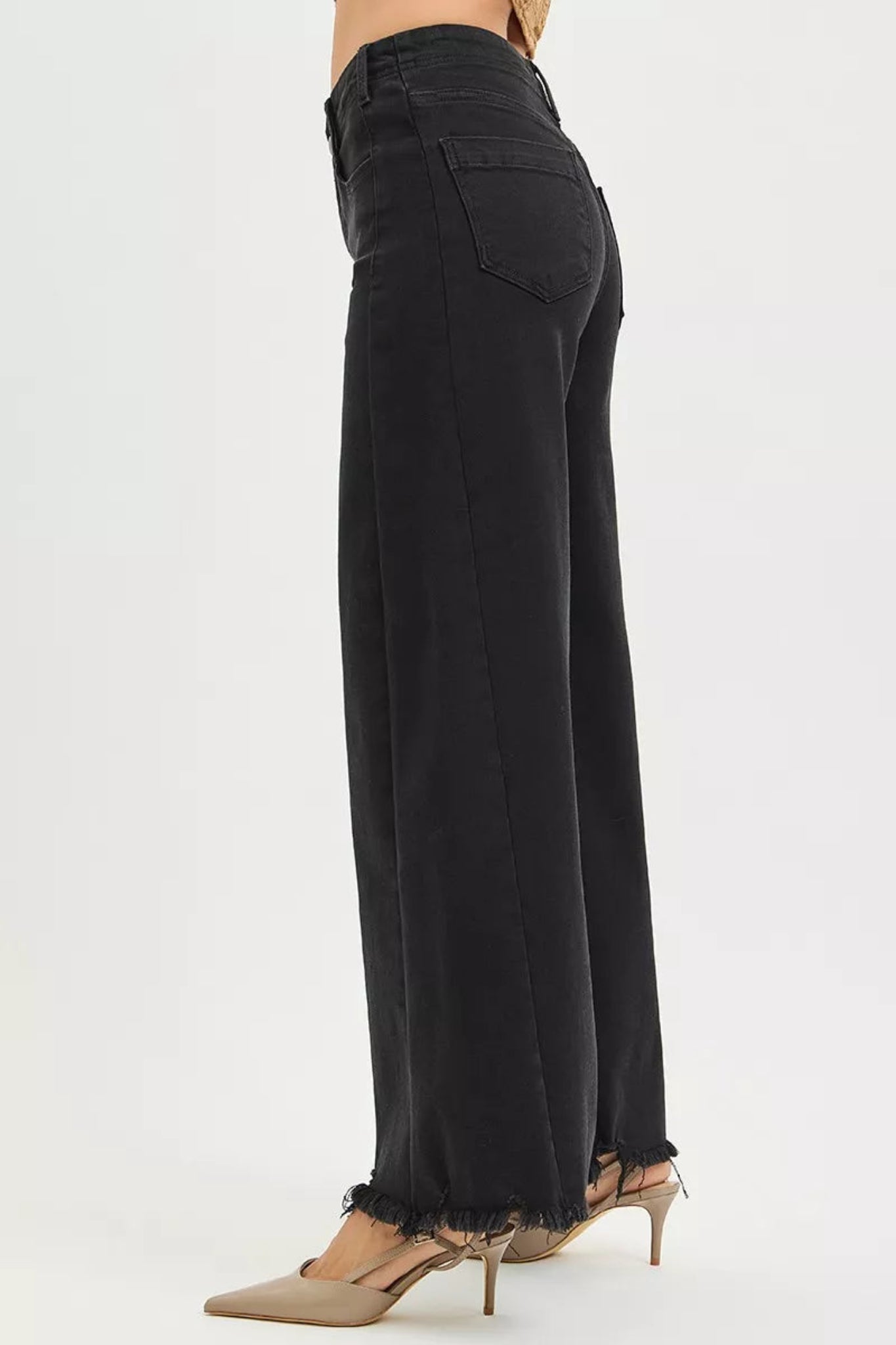 High waisted black wide leg denim jeans with raw edge hem and full length cut