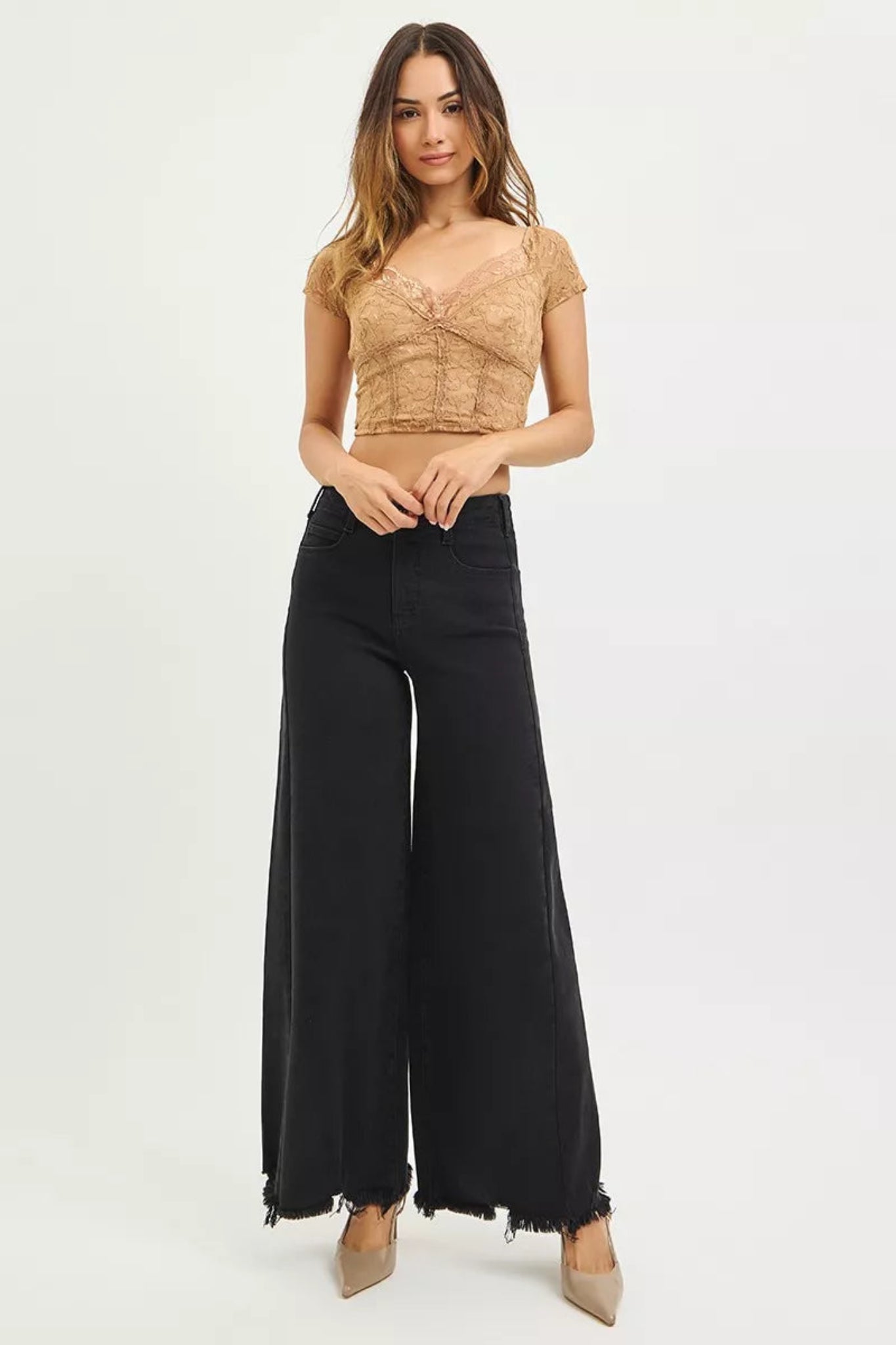 High waisted black wide leg denim jeans with raw edge hem and full length cut