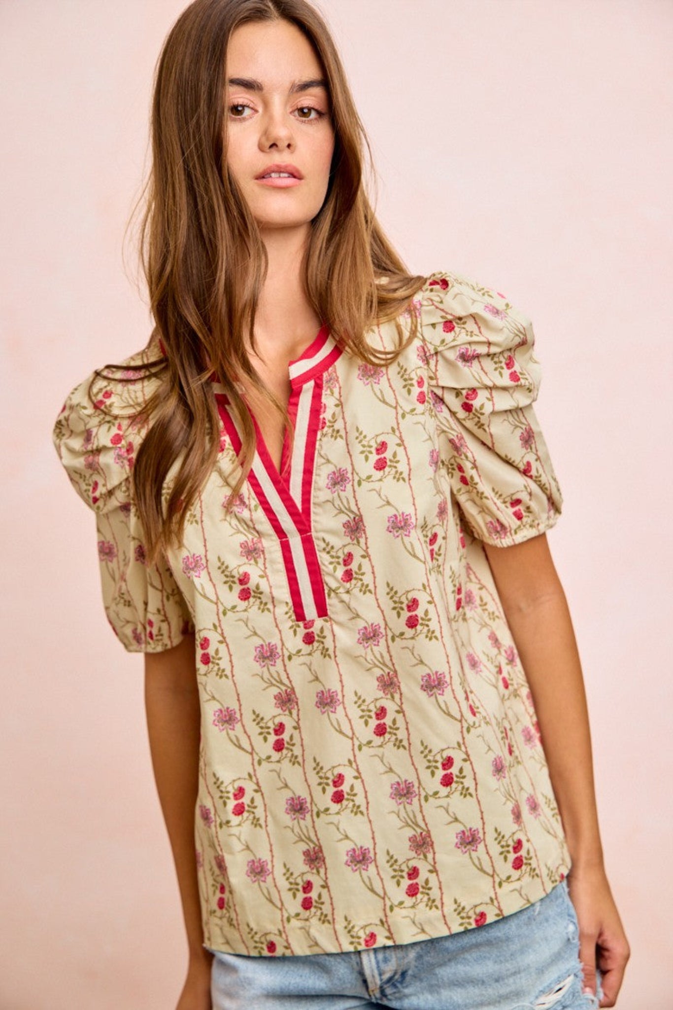 BiBi floral blouse featuring soft lightweight fabric, gathered sleeves, and contrast neckband detail with a feminine floral print design. Relaxed boutique top perfect for casual everyday outfits, spring styling, and effortless chic looks.