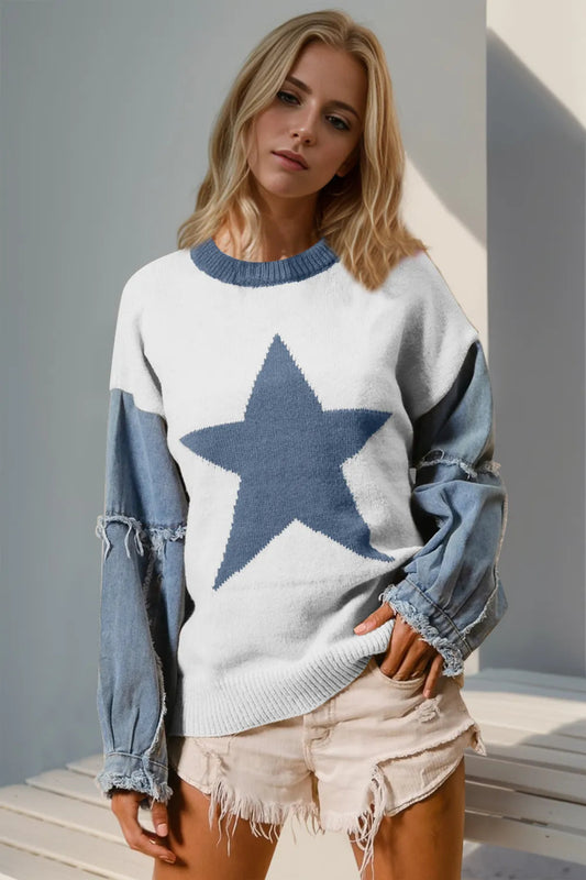 Blue star oversized knit sweater with contrast frayed denim long sleeves styled with distressed shorts, casual women’s boutique fall outfit.