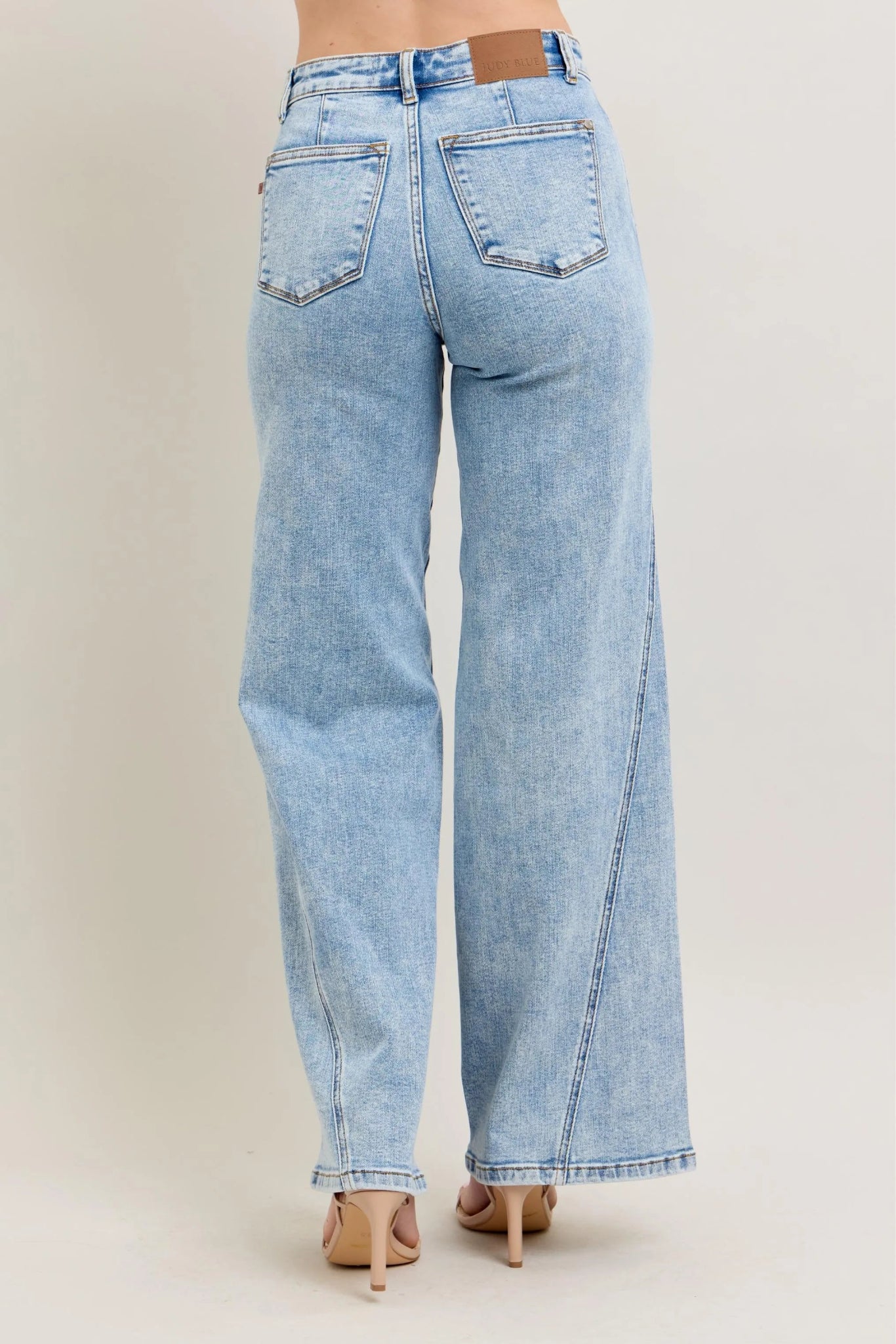 Judy Blue high waist light wash wide leg jeans with skewed inseam and relaxed fit