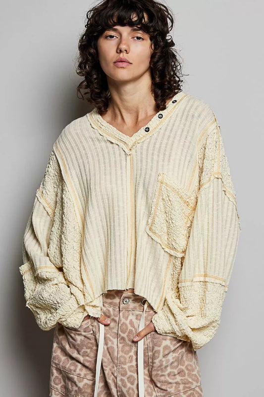 POL women’s cream textured V-neck oversized long sleeve top with raw seam detail and mixed fabric panels