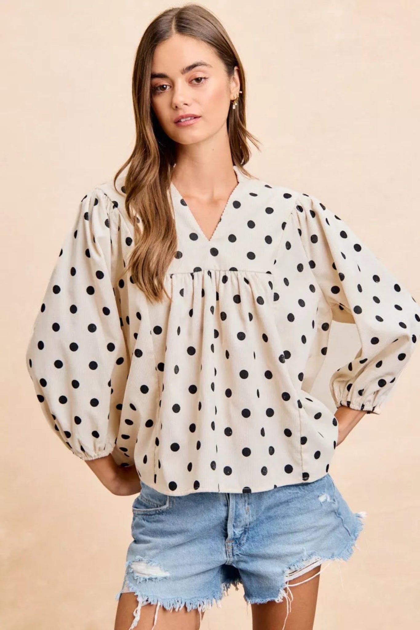 BiBi polka dot corduroy blouse featuring soft textured fabric, playful polka dot print, flattering V-neckline, and quarter length sleeves. Casual boutique top with relaxed fit perfect for everyday styling, fall outfits, and effortless chic looks.