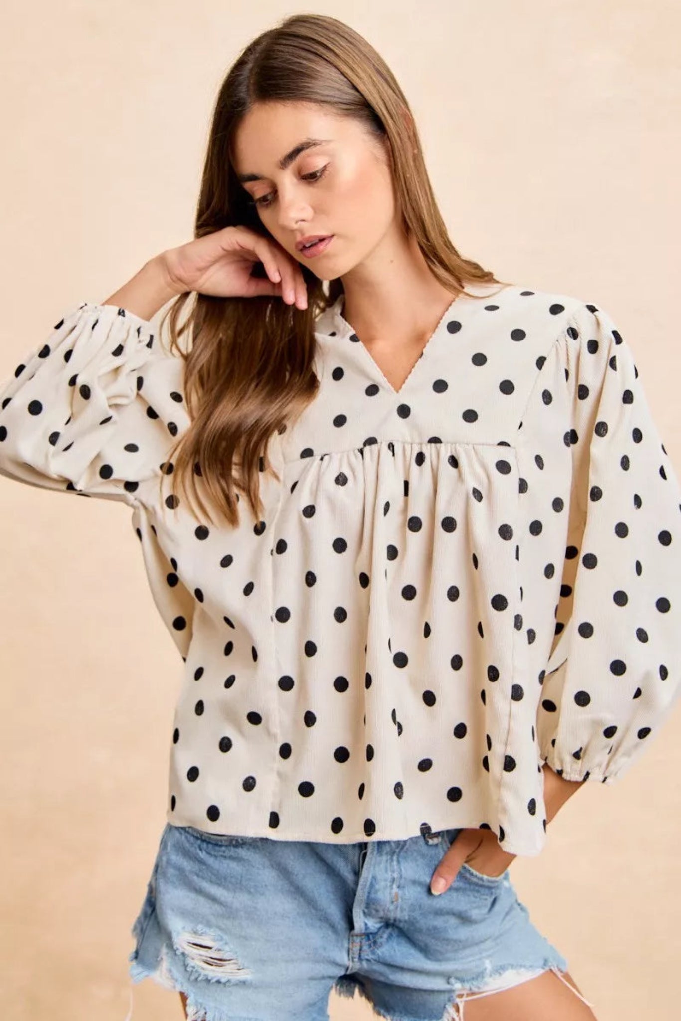 BiBi polka dot corduroy blouse featuring soft textured fabric, playful polka dot print, flattering V-neckline, and quarter length sleeves. Casual boutique top with relaxed fit perfect for everyday styling, fall outfits, and effortless chic looks.