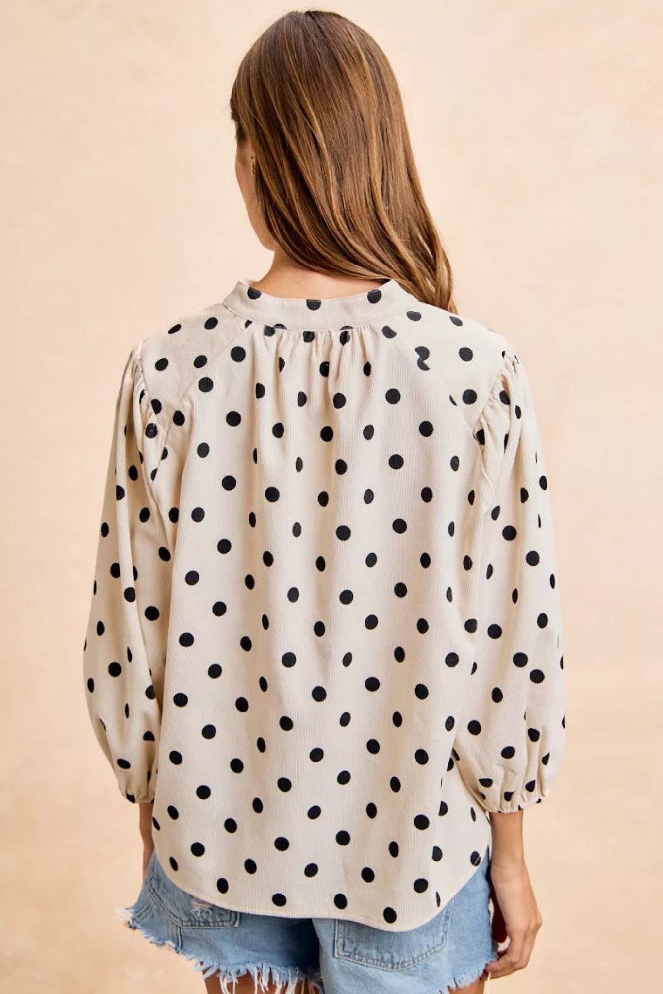 BiBi polka dot corduroy blouse featuring soft textured fabric, playful polka dot print, flattering V-neckline, and quarter length sleeves. Casual boutique top with relaxed fit perfect for everyday styling, fall outfits, and effortless chic looks.