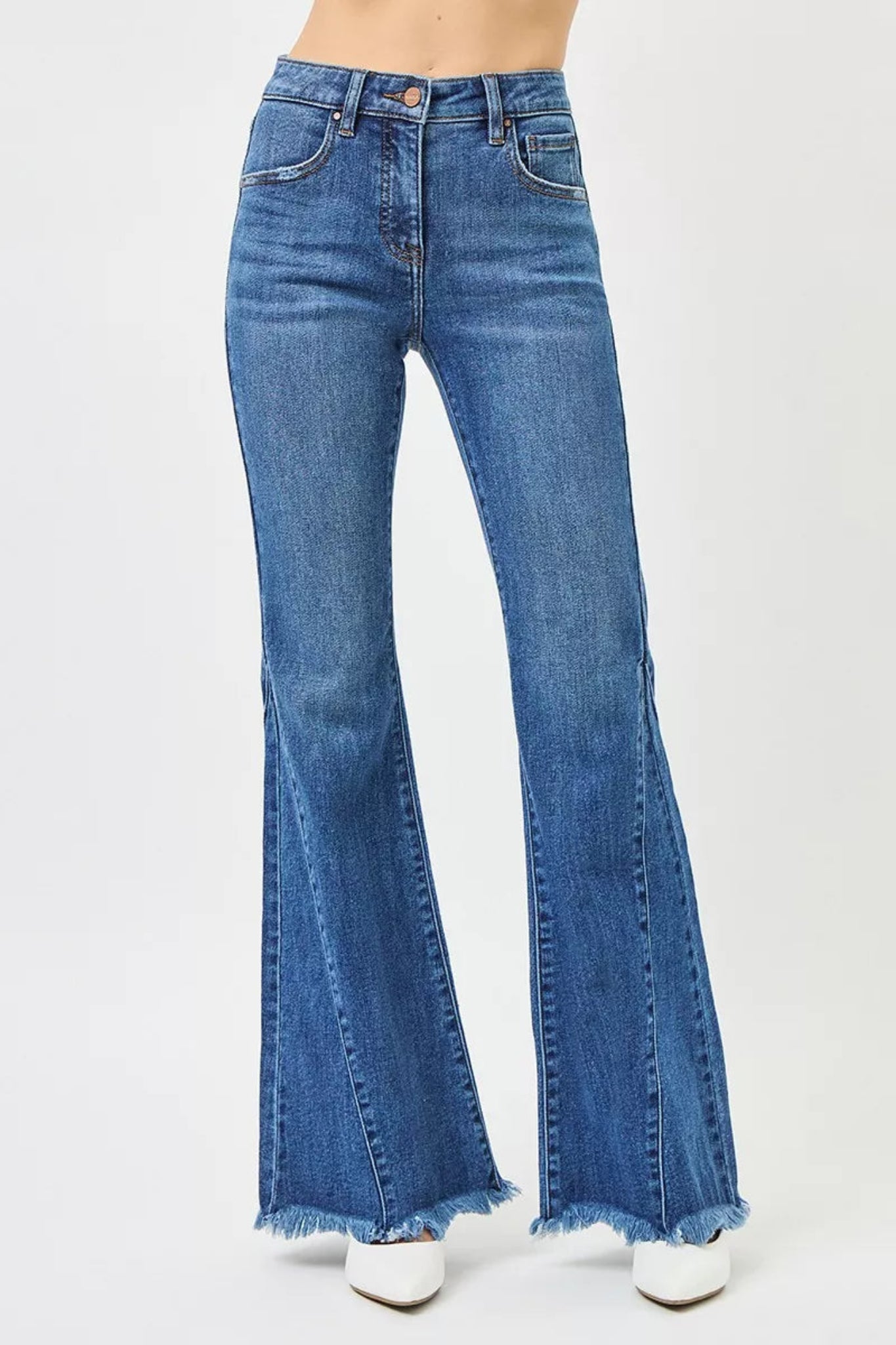 RISEN Mid Rise Flare Side Seam Detailing Jeans in medium wash denim with flattering mid-rise fit, subtle side seam detailing, and trendy flare leg silhouette. Comfortable stretch denim perfect for everyday wear, casual outfits, and boutique fashion styling.
