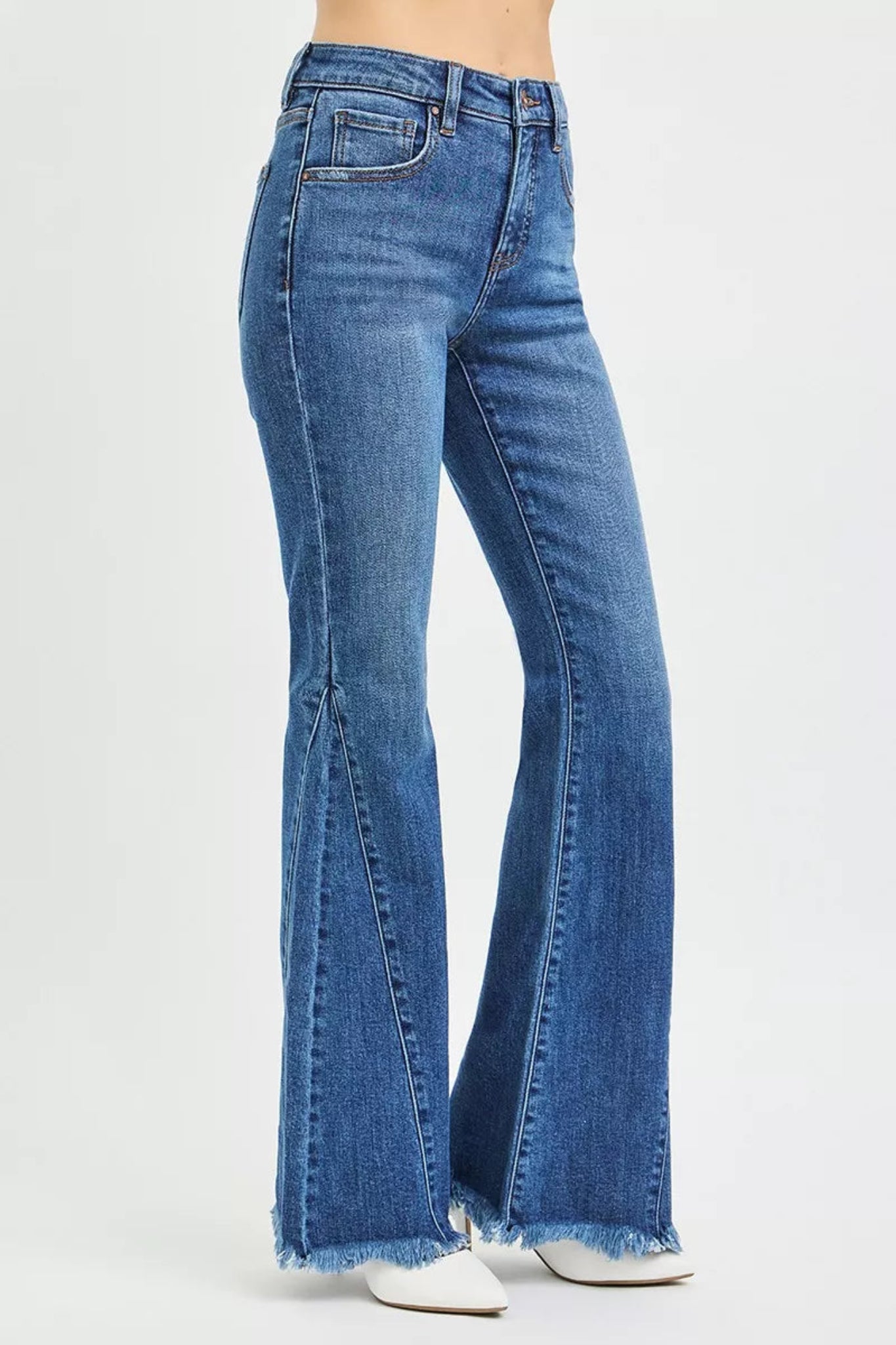 RISEN Mid Rise Flare Side Seam Detailing Jeans in medium wash denim with flattering mid-rise fit, subtle side seam detailing, and trendy flare leg silhouette. Comfortable stretch denim perfect for everyday wear, casual outfits, and boutique fashion styling.