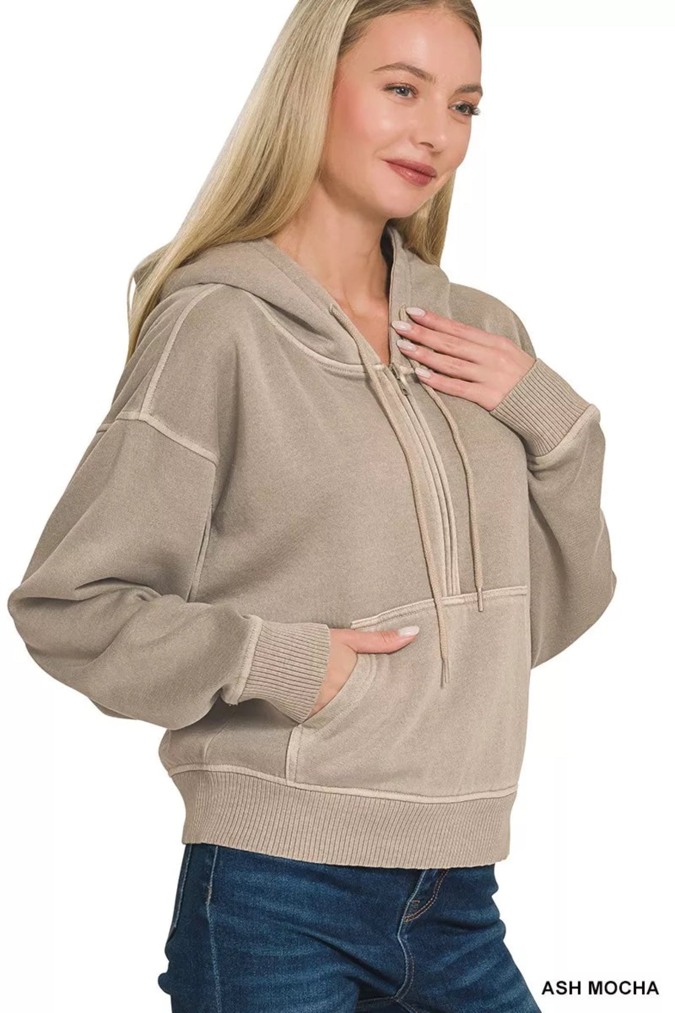 Model wearing an ash mocha half-zip hoodie with hood, kangaroo pocket, and relaxed fit casual sweatshirt.