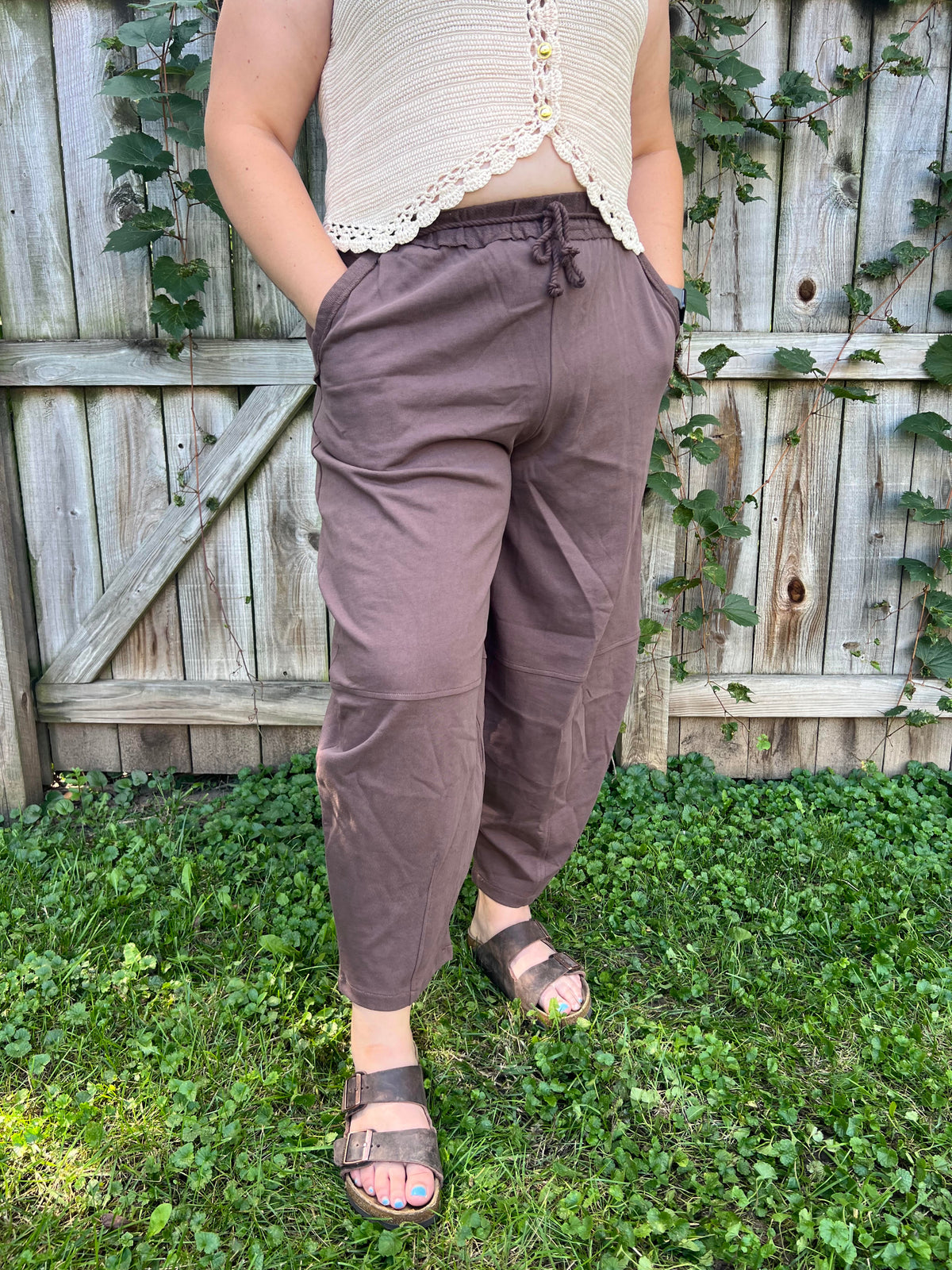 Women's mocha brown barrel leg sweatpants featuring a relaxed fit, elastic waistband, functional side pockets, and soft cotton fabric.