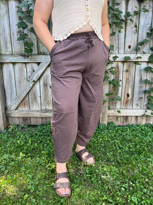 Women's mocha brown barrel leg sweatpants featuring a relaxed fit, elastic waistband, functional side pockets, and soft cotton fabric.