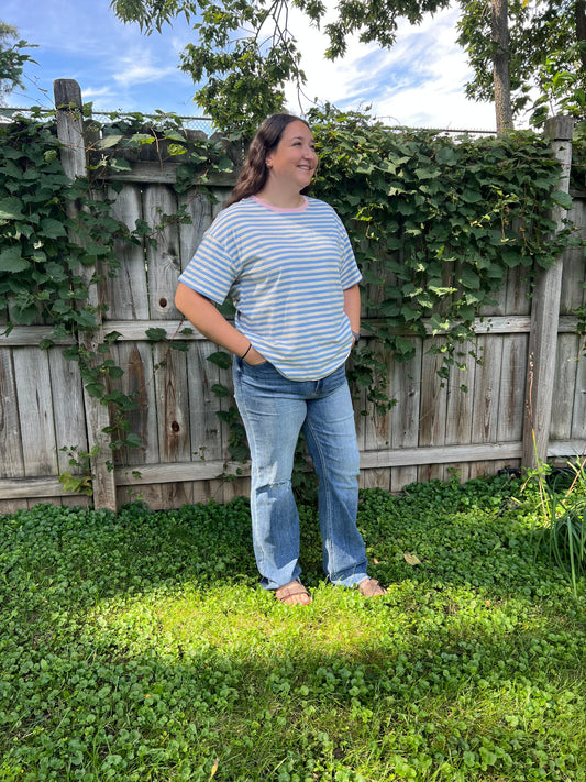 Women's blue and cream striped short-sleeve T-shirt with pink trim around the neckline