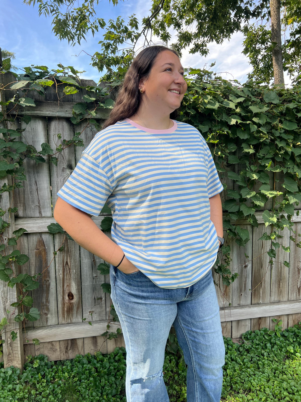 Women's blue and cream striped short-sleeve T-shirt with pink trim around the neckline